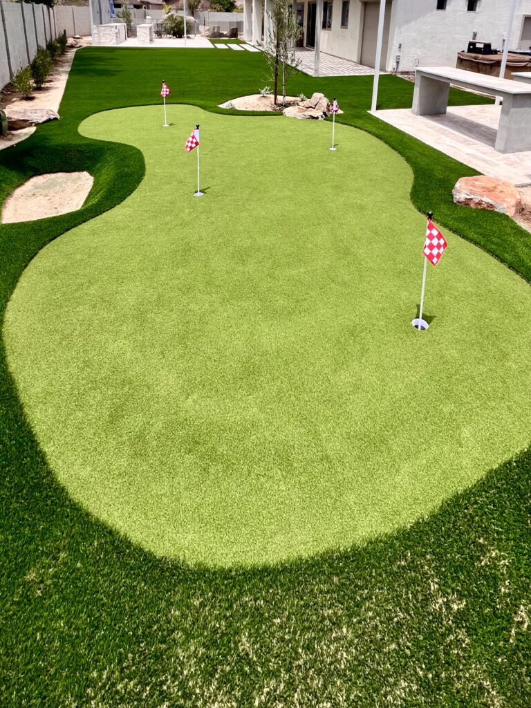 Completed backyard putting green installation in Chandler AZ with custom fringe and chipping area Completed backyard putting green installation in Chandler AZ with custom fringe and chipping area