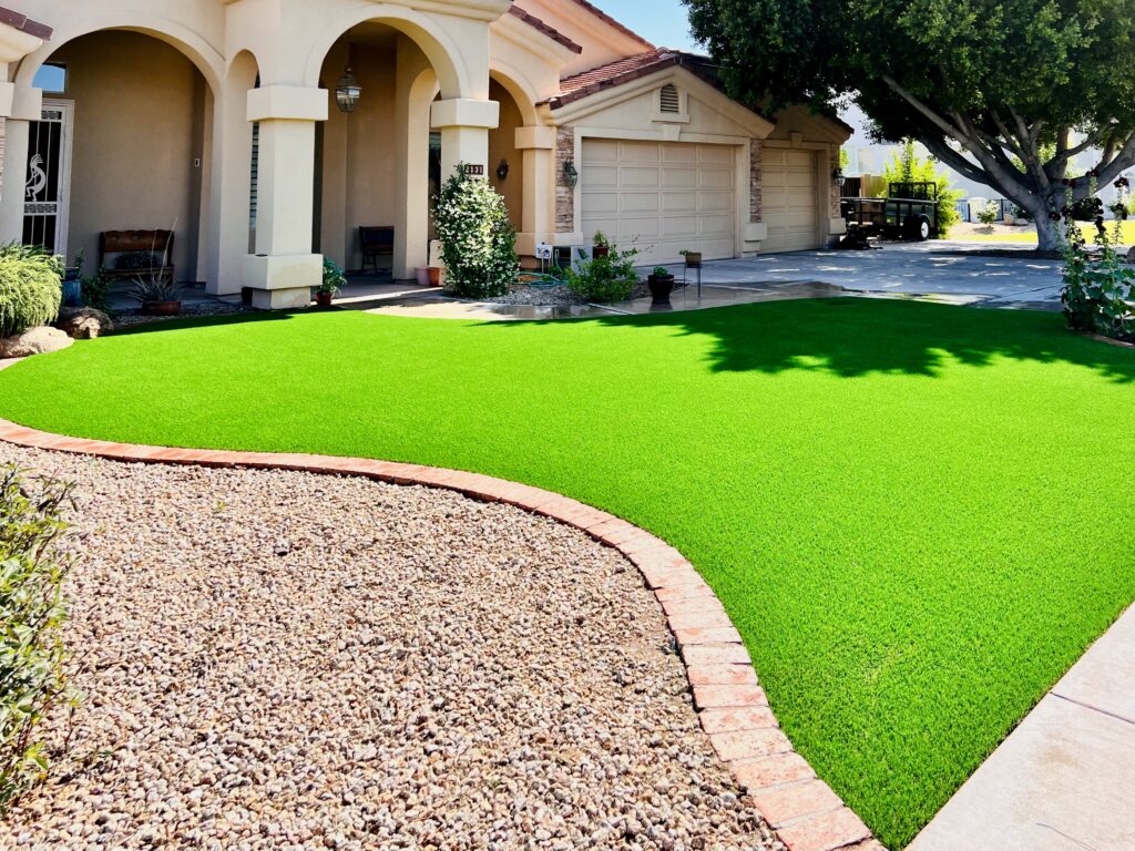 artificial-grass-install-3 Artificial turf being installed and trimmed in a Chandler backyard